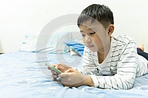 Home school and new normal lifestyle concepts.Asian boy studying through online media and do homework at home due to social
