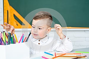 Home schooler. Concept of education and reading. Cute little boy studying.