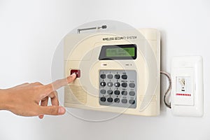 Home security system with hand pushing red button