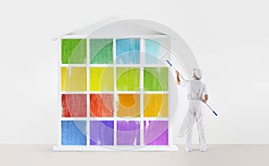 Home service concept. painter man with paint roller, painting a