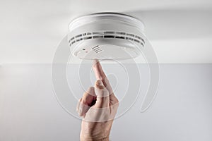 Home smoke and fire alarm detector checking, testing or replace battery