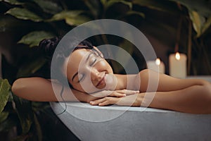 Home Spa Relax Beauty Woman Portrait in Bathtub with Tropical Plants