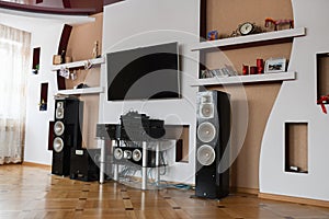 Home speaker system. Modern Home Theater Room Interior with Flat Screen TV