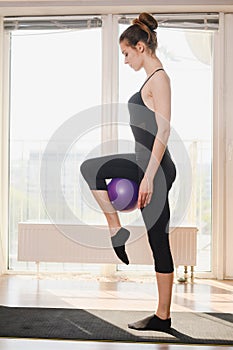 Home sport female training exercise with ball