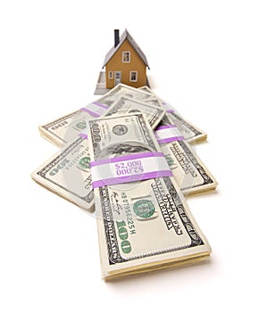 Home and Stacks of Money Isolated