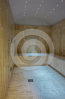 Home steam room in style of Turkish hamam with marble walls