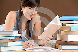 Home study - woman teenager write notes photo