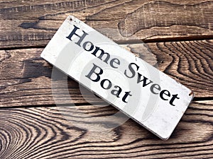 Home Sweet Boat sign on dark wooden boards