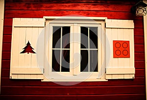 Home sweet home: red house with white windows.