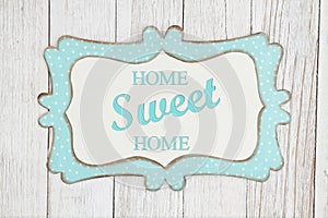 Home Sweet Home text on a retro wood picture frame