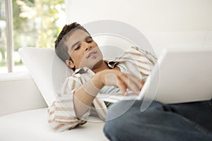 Home Tech Man on Sofa with Laptop