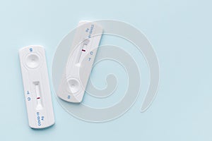 Home testing kit for coronavirus on a blue background