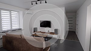 Home theater system in living room of cozy apartment with scandinavian interior