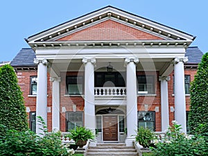 home with two story front porch with classical style columns