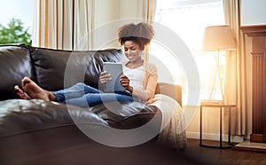 Home, typing and black woman with tablet, smile or connection with lens flare, relax or digital app. African person