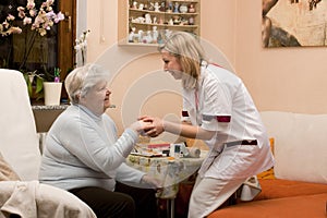 Home visit doctor with senior