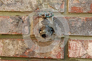 Home water faucet outdoors - spigot at center