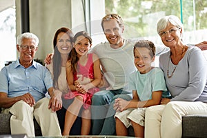 Home is where the heart is. Portrait of a loving multi-generational family sitting together at home.