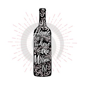 Home is where the wine is - lettering inside a wine bottle with ornament