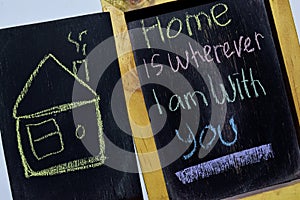 Home is wherever I am with you on phrase colorful handwritten on blackboard