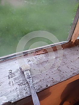 vintage home window repair tools brush window sill dacha painting process photo