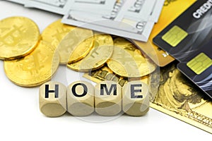 Home wooden blocks of money with dollars,bitcoins,credit card background,Saving money for buy house concept
