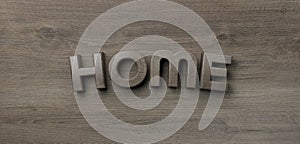 Home word wrote on wooden background