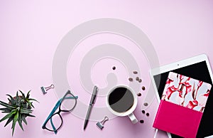 Home work. Business flat lay with cup of coffee, note, pencil, eye glasses, tablet and sicculent on pink background