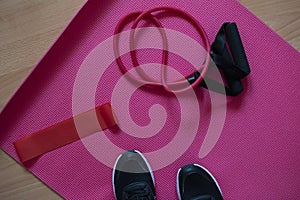 Home workout equpment.  Workout from home durig 2020 self-isolation. Yoga matt,  training sneakers, ropes