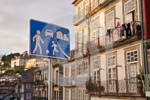 Home zone road sign in Porto, Protugal on old houses background