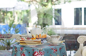 Homebakery cake and fresh fruit with English tea