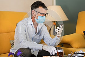 Homebound man with mask and gloves medical photo