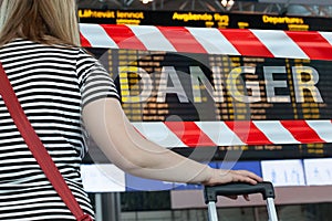 Homecoming during the global pandemic covid-19 quarantine and closed airport concept. Woman in closed international airport