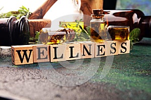 Homegrown and aromatic herbs with rosemary and basil. Wellness sign with wooden cubes