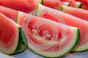 Homegrown small watery and tasty sliced into sections watermelon.