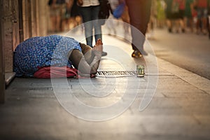 Homeless beggar. Woman asking for alms. Street. Rome Italy