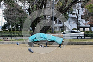 Homeless in the city center of Hiroshima, Japan. Sleeping in the