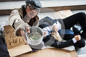 Homeless man ask for money in city