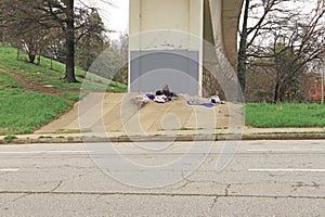Homeless man camped out under a bridge just outside of downtown Atlanta Georgia