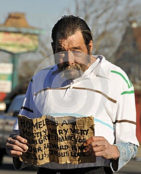Homeless Man Holding Sign