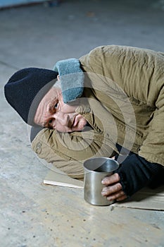 Homeless man lying on the floor