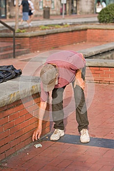 Homeless man reaching For Money