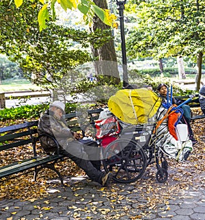 Homeless man sleeping in central park in Manhattan