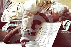 Homeless man sleeping on walkway street.
