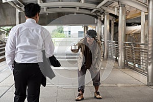 Homeless old man with bowl to beg money