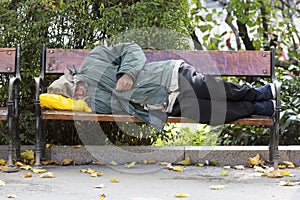 Homeless person on a bench