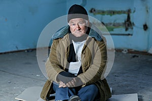 Homeless person sitting on the floor photo