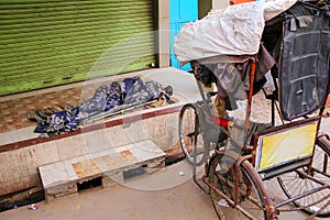 Homeless person sleeping under blanket in the street in Taj Ganj neighborhood of Agra, Uttar Pradesh, India