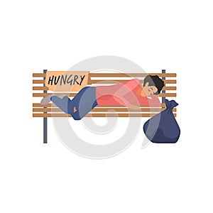 Homeless poor man sleeping on city park bench with sign Hungry