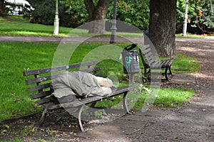 Homeless sleeping on a park bench